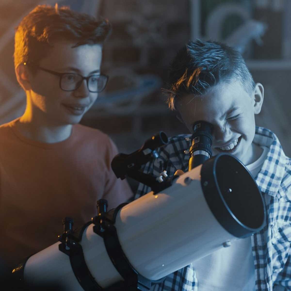 kids looking through telescope